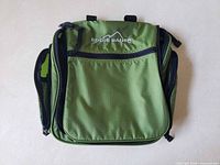 Front view of green Eddie Bauer toiletry bag closed