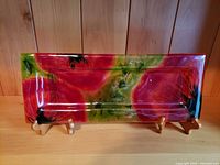 front view of glass tray showing full poppy pattern
