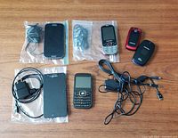 All phones, chargers and earbuds on table