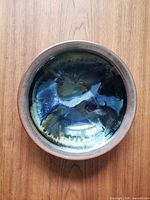Top view of entire pottery bowl showing multicolour glaze