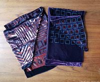 Both scarves laid flat showing fronts and patterns