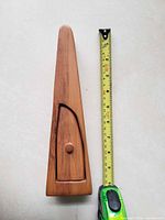 Front view showing full height next to tape measure