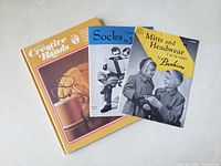 Front covers of the three books showing titles and condition