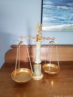Full view of green onyx balance scale with pans