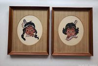 Front view showing both framed petitpoint portraits
