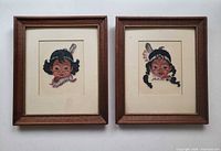 Both framed petit point portraits side by side