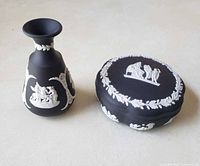 Vase and lidded box side by side to show overall design and scale