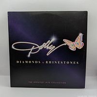 Front album cover showing title, artist, butterfly logo