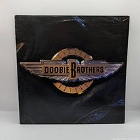 Front sleeve with metallic emblem