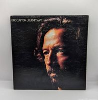 Front gatefold cover with album title and portrait of Eric Clapton