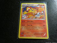 Front of sleeved Infernape 20/114 holo card