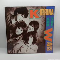 Front jacket showing band photo and title graphics