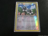 Front of Klink reverse holofoil card showing artwork, stats and foil sheen
