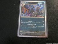 Front of Lokix Reverse Holo card showing title, number, rarity, artwork, foil sheen