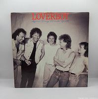 Front album jacket showing band photo and title