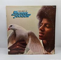 Front cover showing album title and Michael Jackson with white dove
