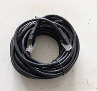 Coiled black Cat6 cable with RJ45 connectors