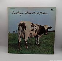 Front gatefold sleeve showing album title and cow image