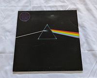Front gatefold cover showing prism artwork and edge wear