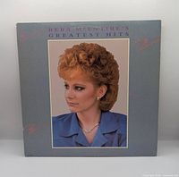 Front sleeve showing artist portrait and title