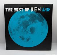 Front sleeve with blue moon graphic and album title.