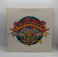 Front gatefold cover with album title and artist names