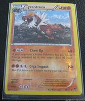 Front of Tyrantrum holographic card in sleeve