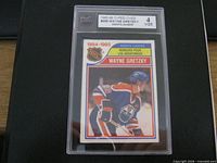 Front view of graded Wayne Gretzky Assist Leaders card showing grade 4 VGE label