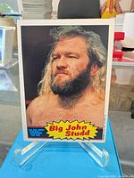 Front view of Big John Studd trading card on stand