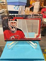 Front of card on stand showing player image and net die-cut