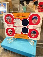 Front of quad jersey card showing four swatches and player images