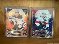 Front view of both Point Leaders cards in toploaders