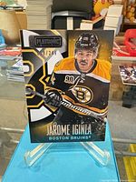 Front of card on stand showing player image, Playbook logo and serial number