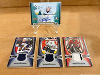Full lot showing all four Upper Deck Power Play cards on surface