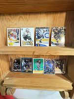 All nine Daniel Sedin hockey cards displayed on two shelves