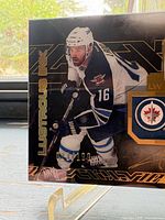 Front view of card showing player image, Lustrous Ink text, serial number