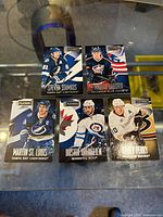 Group shot of all five Playbook serial-numbered cards
