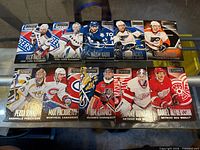 Ten Panini Playbook Parallel hockey cards laid out front-up