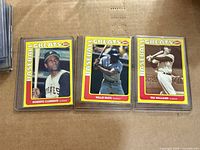 All three 1991 Swell Baseball Greats cards in rigid holders: Roberto Clemente, Willie Mays, Ted Williams