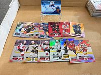 All cards laid out plus Barzal insert on stand