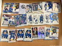 All 27 Vancouver Canucks trading cards laid out to show fronts and overall mix