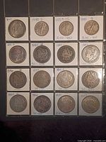 Obverse view of 16 coins in flips with date/mint labels visible