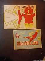 Fronts of both sheets: promotional cover card and uncut figure sheet
