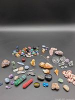 Full assortment of crystals and minerals spread on black background