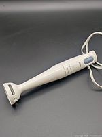 Full view of Braun immersion blender showing body and blending shaft