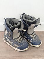 Front and side view of both boots showing uppers, lacing and toe condition