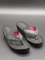 Pair of Coach platform thong sandals showing overall condition