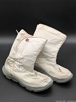 Side view of both Crocs winter boots showing overall design and condition