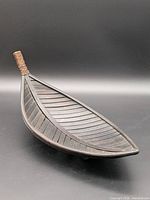 Top view of wooden leaf basket showing shape and surface