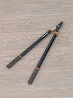 Full view of Fiskars long-handled bypass loppers on floor